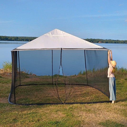 Woman checking the upper corner of a 250 × 1650 cm black mosquito net installed on a 4 × 4 m square gazebo