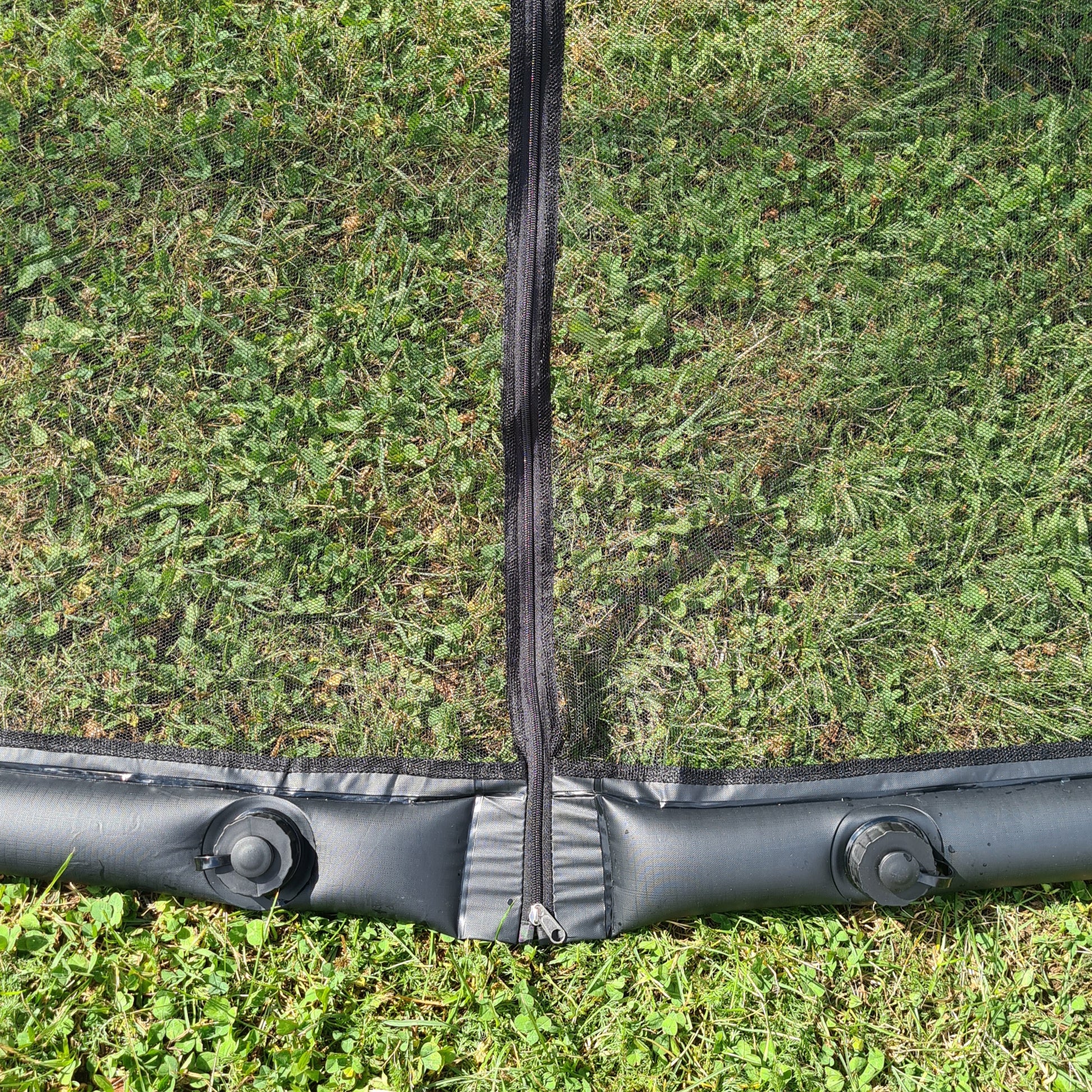 Filled lower water tube with two redesigned closed caps beside the mosquito-net zipper.